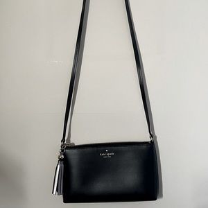 Gently used Kate Spade cross body in black w/ tassel (roughly 10 x 6 x 1.5)